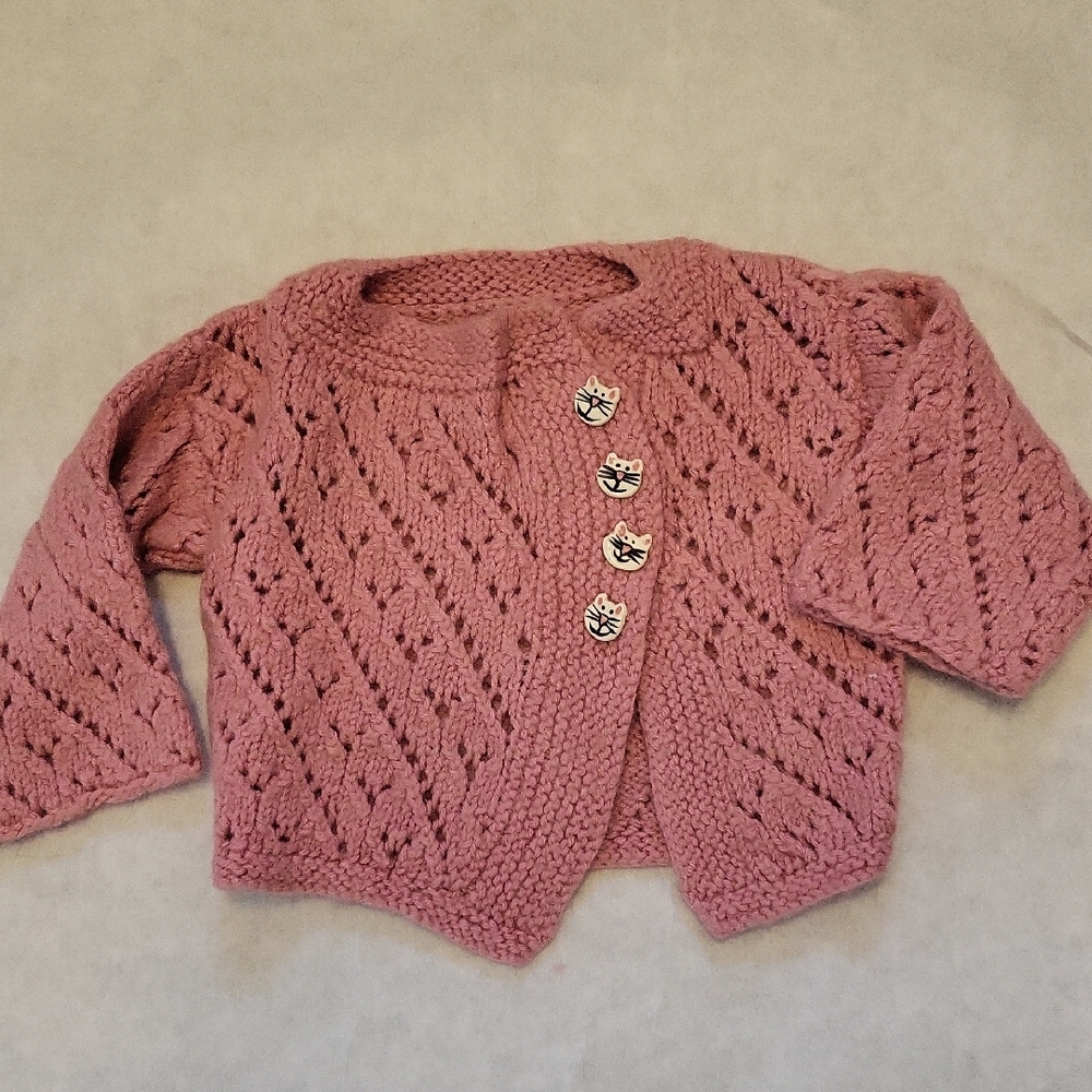 Rose colored knit cardigan with cat buttons